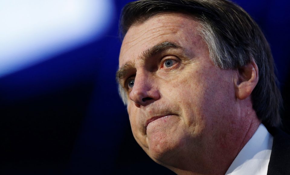 Federal deputy Jair Bolsonaro of the Party for Socialism and Liberation (PSL), a pre-candidate for Brazil's presidential election, attends a debate at the Industry Confederation event in Brasilia, Brazil July 4, 2018. REUTERS/Adriano Machado