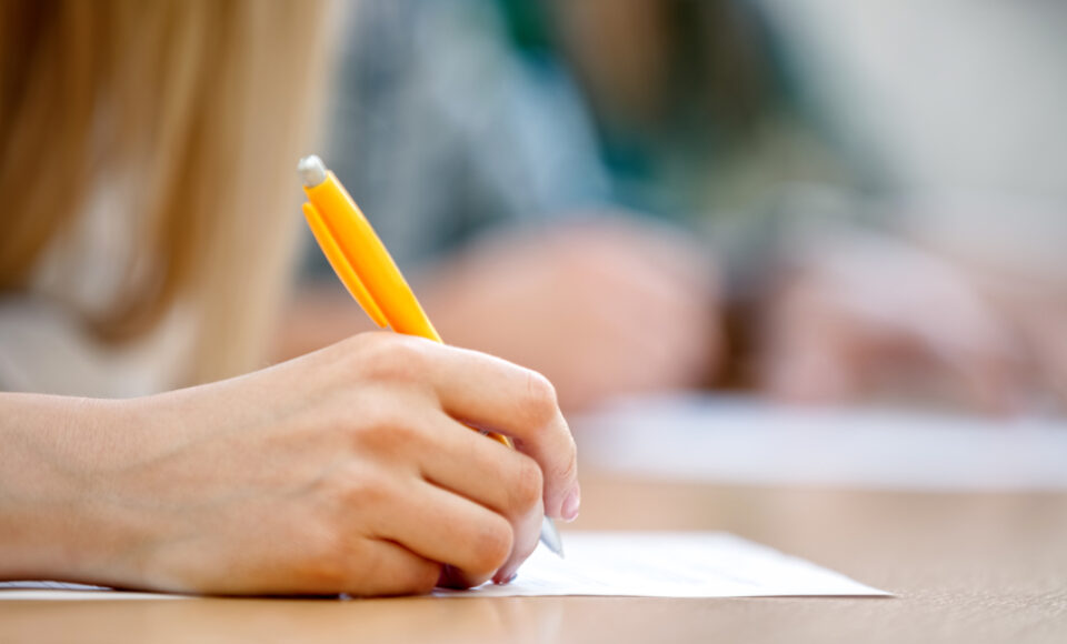 Female hand writing, close up