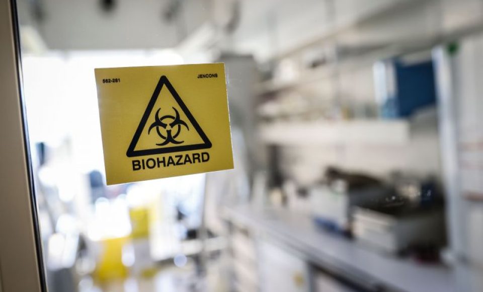 A picture taken in a laboratory of the National Reference Center (CNR) for respiratory viruses at the Institut Pasteur in Paris on January 28, 2020 shows a biohazard sticker on the entrance of a room. The CNR analyses the tests for respiratory viruses among which coronavirus. The deadly new coronavirus that has broken out in China, 2019-nCoV, has so far killed 106 people and infected over 4,000 -- the bulk of them in and around Wuhan. / AFP / Thomas SAMSON