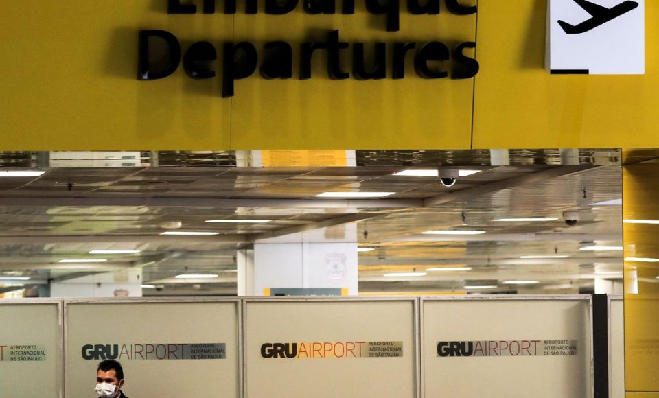 A worker, wearing a protective face mask, is seen at Guarulhos International Airport amid fears of coronavirus disease (COVID-19) in Guarulhos, Sao Paulo state, BraziI, April 1, 2020. REUTERS/Roosevelt Cassio